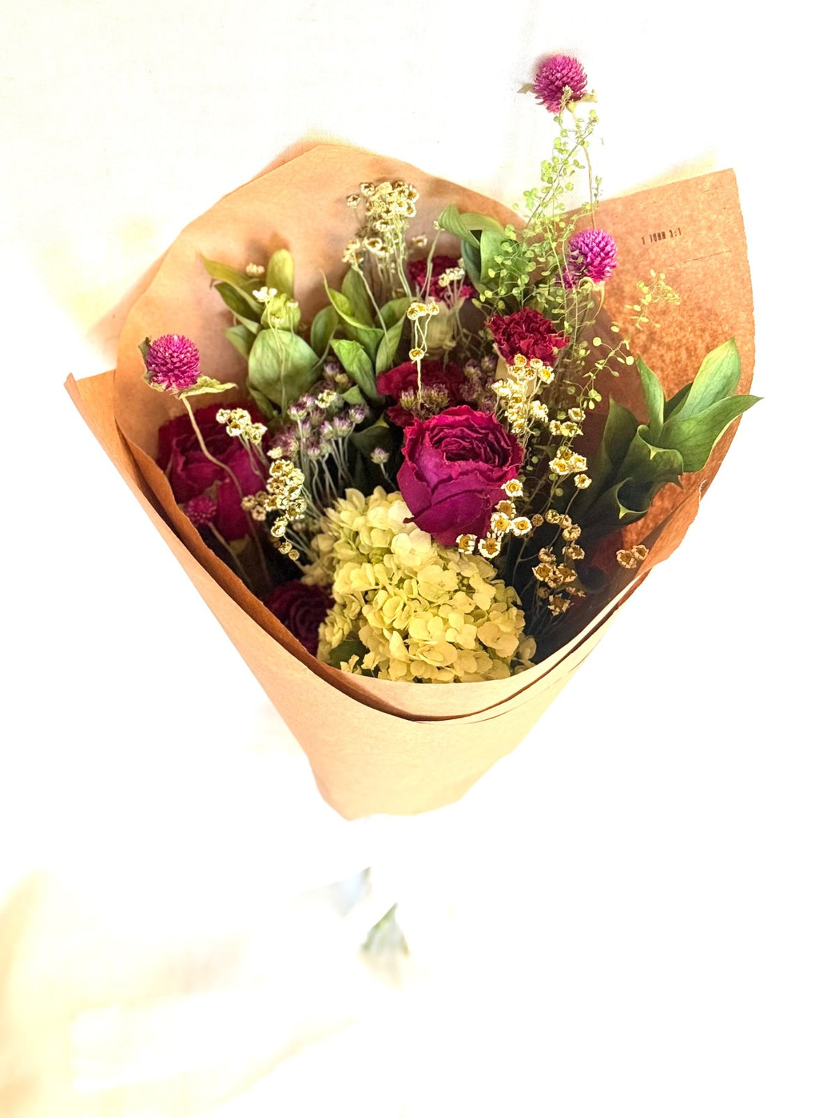 Alternate view of the paper-wrapped Gathered Meadow bouquet