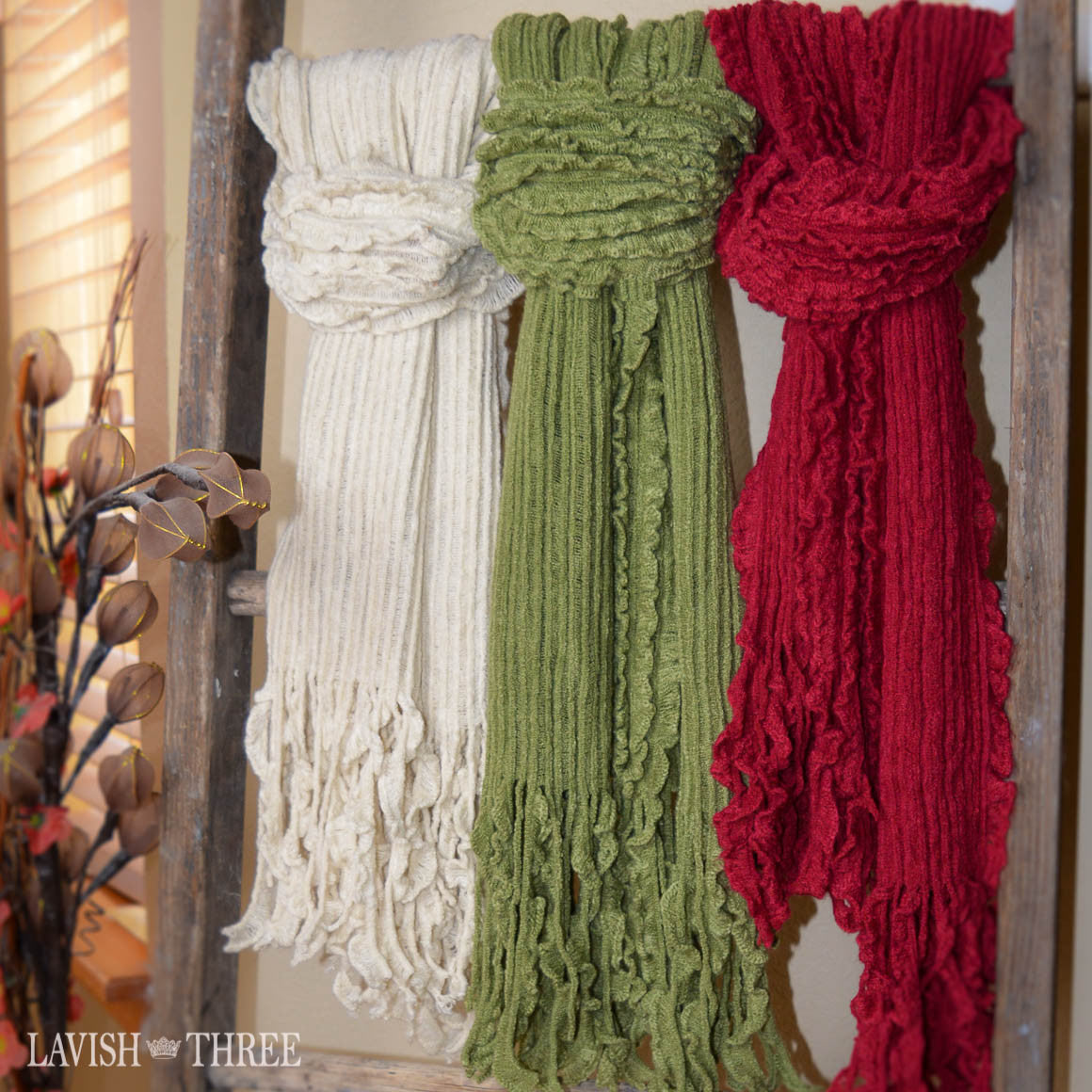 Warm ruffled scarves in ivory, sage green, cranberry