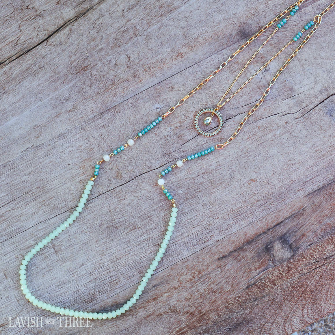 Gold chain necklace with blue and green beads and pendant