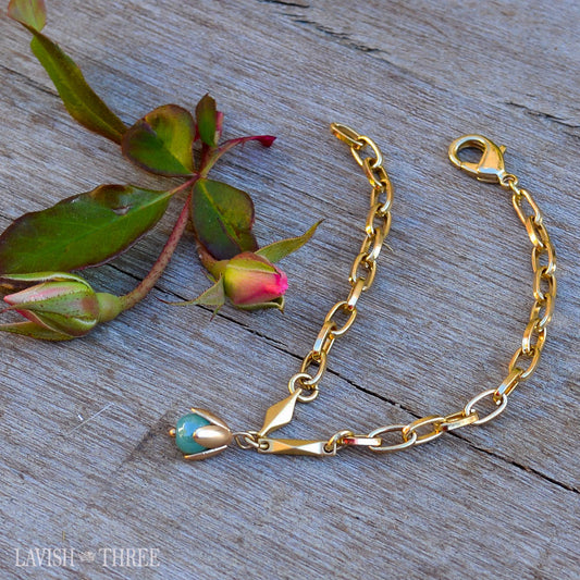 Delicate gold bracelet, light green tear drop bead