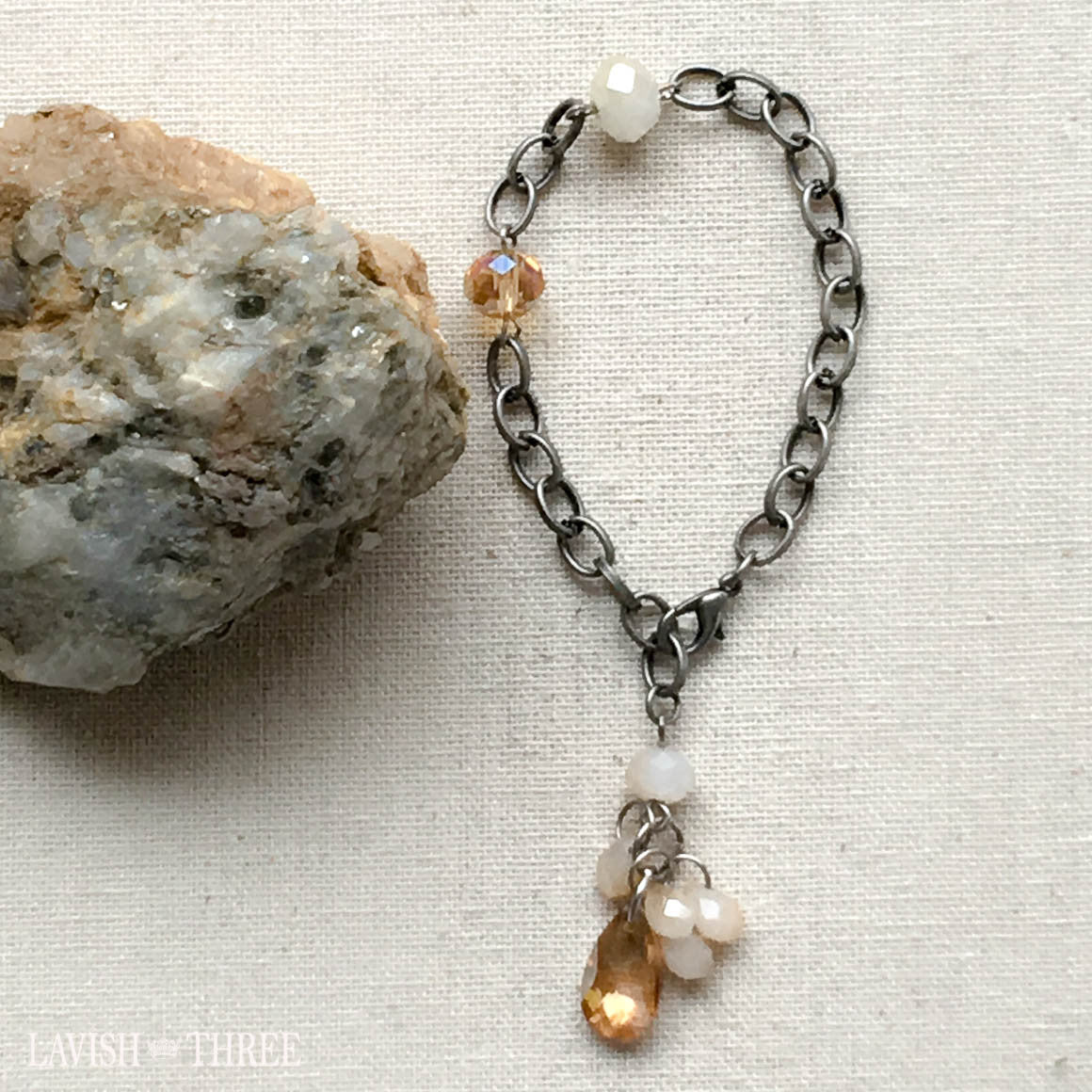 brushed silver bracelet with crystal bead and gem pendant, Lavish Three