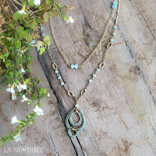 Statement with Style elegant gold chain, blue crystal pendant charm